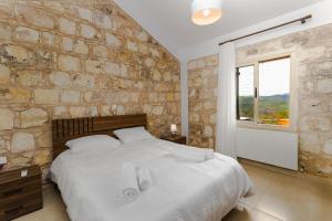 Ένα ή περισσότερα κρεβάτια σε δωμάτιο στο Simou villa +7 φωτογραφίες