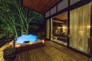 a balcony of a house at night with lights at Zielo Natural Glamping in Villavicencio