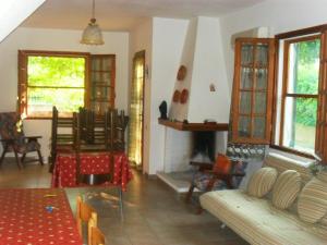 a living room with a couch and a fireplace at Casa Vacanze Gardenia in Solanas
