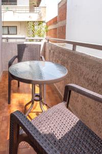 a table and chairs sitting on a balcony at City Life Marina apartment No. 2 in Ampavris