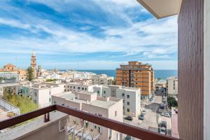 a view of a city from a balcony at Casa della Civetta in Monopoli