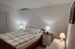 Posteľ alebo postele v izbe v ubytovaní Apartment Tina