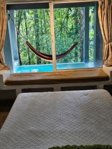 Postelja oz. postelje v sobi nastanitve OLP Treehouse Cerro Azul