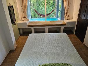 Postelja oz. postelje v sobi nastanitve OLP Treehouse Cerro Azul