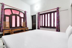 Postel nebo postele na pokoji v ubytování Hotel O Hanuman Bagh + 18 fotografií