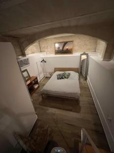 a small bedroom with a bed in an attic at Valletta's Charming Loft Accommodation in Valletta