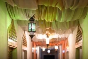 a mosque with a light hanging from the ceiling at Prixma Hotel in San Andrés
