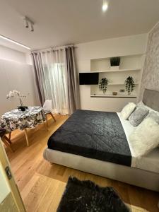 Postel nebo postele na pokoji v ubytování Palazzo Metropolis