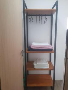 a shelf in a closet with towels on it at APART STUDIOS PONTAL in Ilhéus