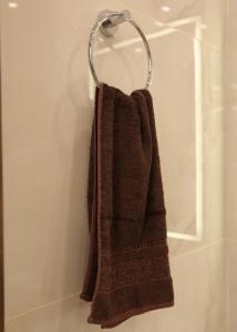 a towel hanging on a towel rack in a bathroom at Amman in Amman