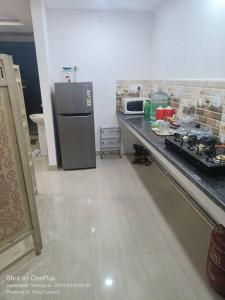Kjøkken eller kjøkkenkrok på Sakez Homestays