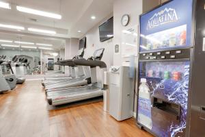 a gym with several treadmills and a treadmill at Spacious & Comfortable Condo at Crystal City in Arlington