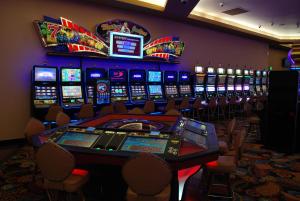 a casino with a bunch of slot machines at Ramada by Wyndham Princess Paramaribo in Paramaribo