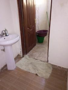 a bathroom with a sink and a toilet at Annex in Kakamega