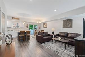 a living room with a couch and a table at New Town House - Heart of Wenatchee in Wenatchee