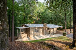 a log cabin in the woods with trees at Oxford Hillside Hideaway in Oxford