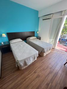 Voodi või voodid majutusasutuse Hotel Tamariz toas