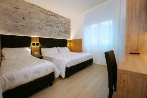Postel nebo postele na pokoji v ubytování Hotel Everest
