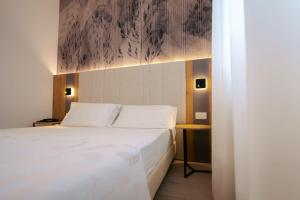 Postel nebo postele na pokoji v ubytování Hotel Everest