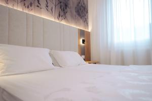 Postel nebo postele na pokoji v ubytování Hotel Everest