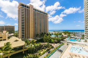 an aerial view of a resort with a pool and the ocean at Ilikai Tower 720 Lagoon View 1BR in Honolulu