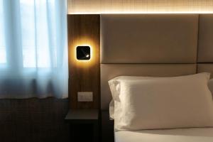 Postel nebo postele na pokoji v ubytování Hotel Everest