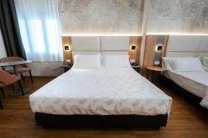 Postel nebo postele na pokoji v ubytování Hotel Everest