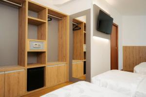 Postel nebo postele na pokoji v ubytování Hotel Everest