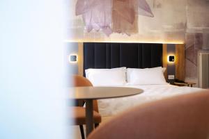 Postel nebo postele na pokoji v ubytování Hotel Everest