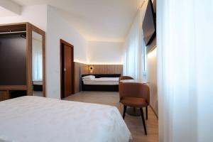 Postel nebo postele na pokoji v ubytování Hotel Everest