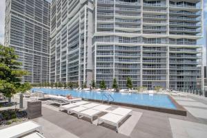a large building with a large swimming pool with buildings at Icon 39th Floor 1 Bedroom apartment- Bay & City View- FREE SPA in Miami