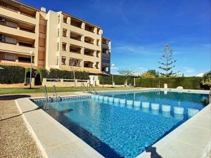 a swimming pool in front of a apartment building at 3 bed ground first floor apartment. Close to beach in Mar de Cristal