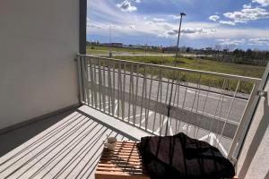 a balcony with a bench and a view of a street at 2 room Apartment, terrace, new building Moruše in Prievoz