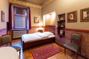 Postel nebo postele na pokoji v ubytování Hotel Continental + 37 fotografií