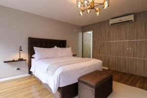 Voodi või voodid majutusasutuse Elegant 1BR in San Isidro toas