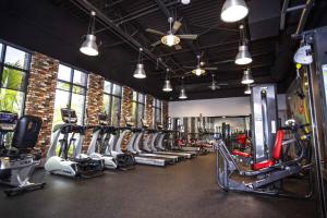 a gym with a row of treadms and machines at Davenport 1 in Davenport