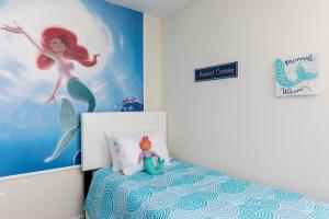 a childs room with a mermaid themed bedroom at 1509 MC - Exquisite 8BR Villa with Pool Games in Davenport