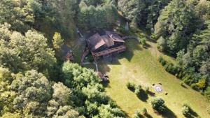 an aerial view of a house in the middle of a forest at The Stone Mason - Large Modern Home on 5 Acres - 2 Hrs from NYC in Pond Eddy