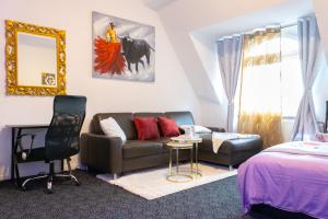 a living room with a couch and a bed at Superior 3 rooms, 4-8 guests, modern, Full equipped in Duisburg