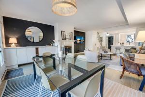 a dining room and living room with a glass table at Chic & Central Foggy Bottom DC Stay in Washington