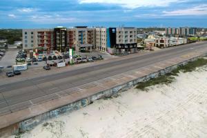 an empty road in a city with buildings at Home2 Suites Galveston, Tx in Galveston