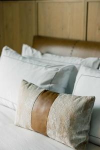 a close up of a bed with a pillow on it at Cloudland at McLemore Resort Lookout Mountain, Curio Hilton in Rising Fawn