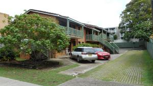 a car parked in a parking lot next to a building at Dunbar Court Unit 4 - 45 Memorial Avenue South West Rocks in South West Rocks