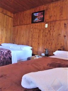 Postel nebo postele na pokoji v ubytování Tesorito House en las Montañas del Quindío