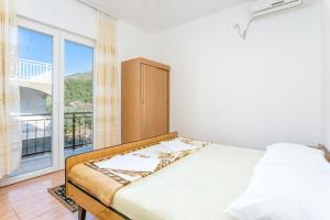 Postel nebo postele na pokoji v ubytování Apartment Podaca 2783c