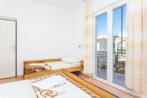 Postel nebo postele na pokoji v ubytování Apartment Podaca 2783c