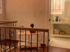 a small kitchen with a table and a counter at Villa Coyoacan in Mexico City