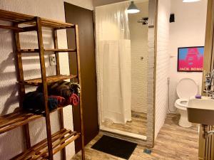 a bathroom with a shower and a toilet at Amazing forest House in the city! Private guest suite - double studio room in Rio de Janeiro