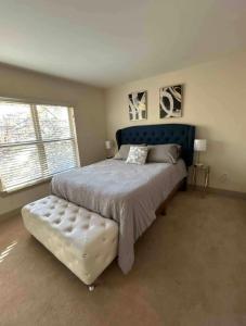 a bedroom with a large bed and a large window at Heart of Atlanta in Atlanta