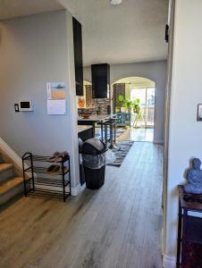 a living room with a kitchen and a dining room at The Love Love Stay in Edmonton